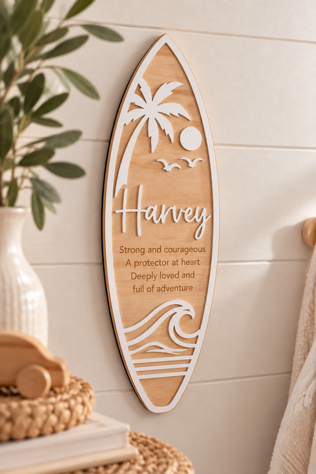 Personalised timber surfboard name sign with white acrylic and engraved name meaning.