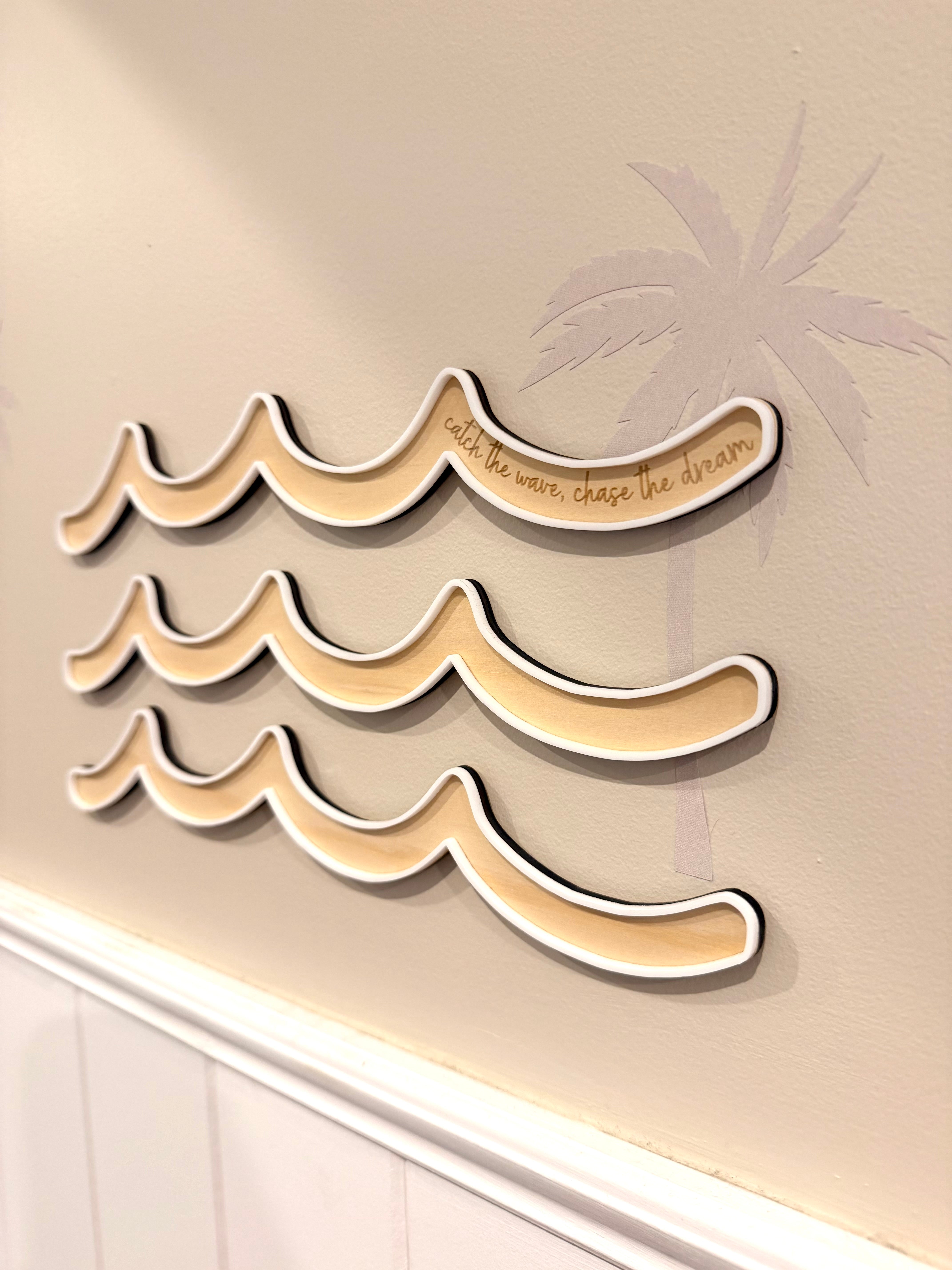 Three waves with quote catch the case, chase the dream engraved on the timber with white border