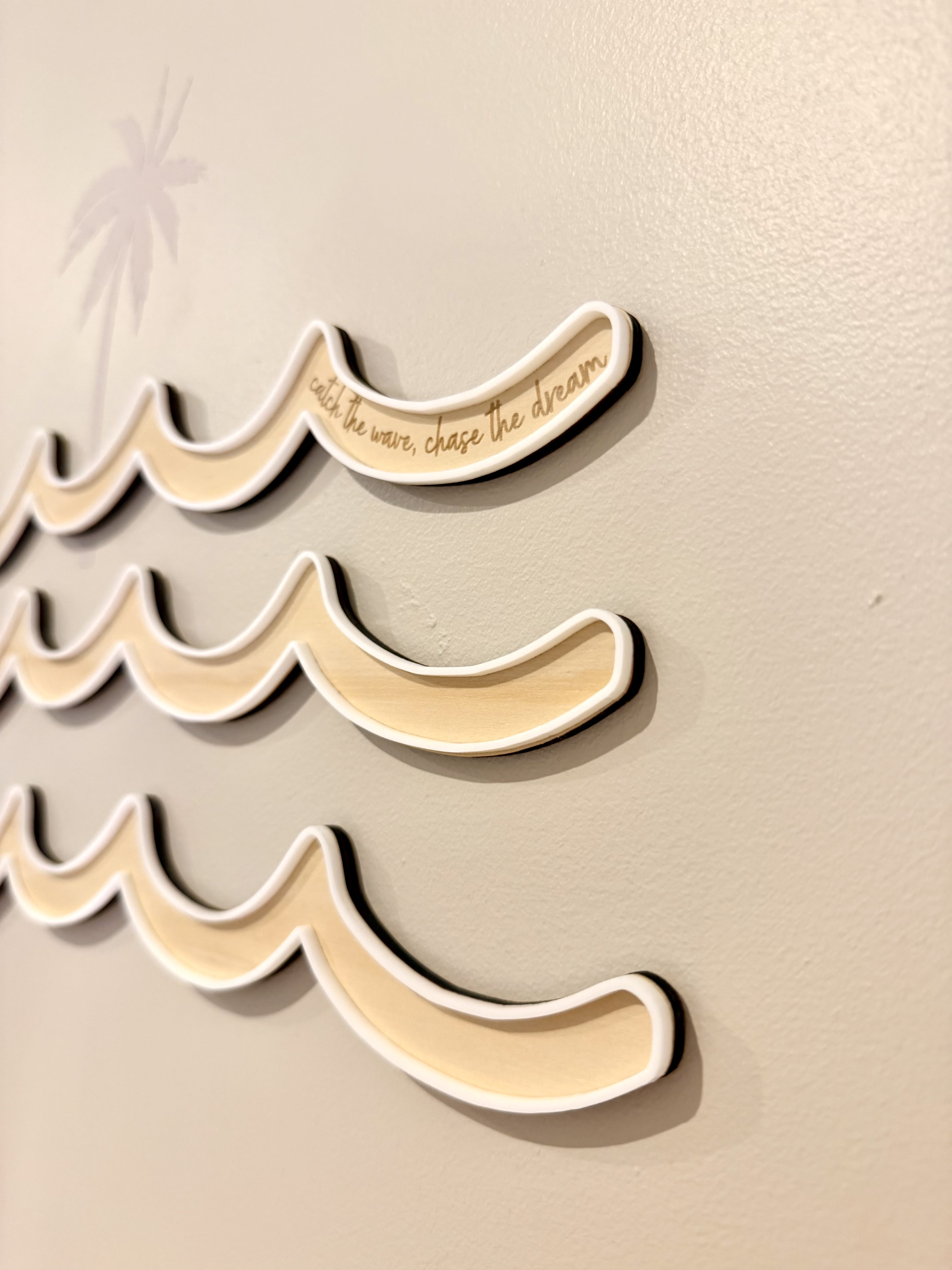 Three waves on timber with white acrylic border