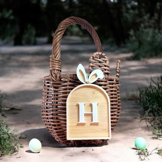 Personalised Easter basket tag with initial letter made from bamboo and acrylic hanging on wicker easter basket
