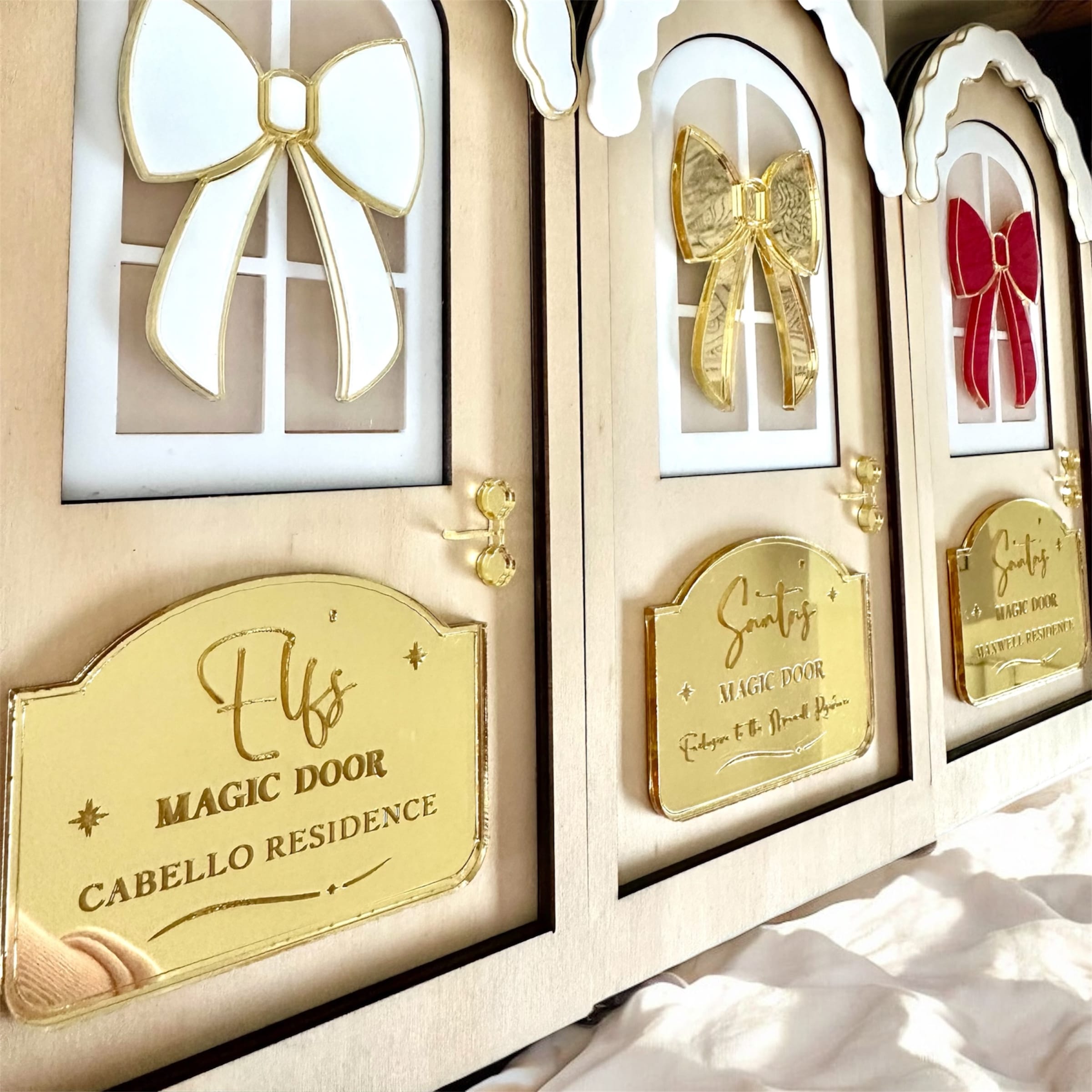 decorative christmas personalised for the family with a bow