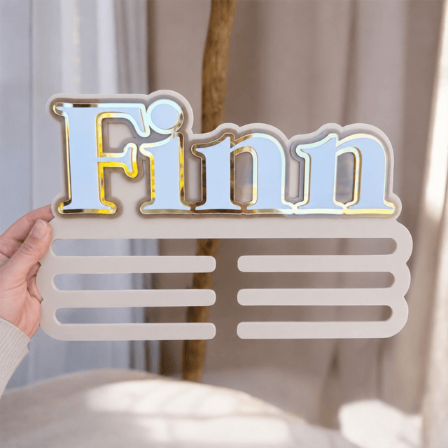 Medal Holder with personalised name 'Finn' for a child's bedroom in beige neutral colours