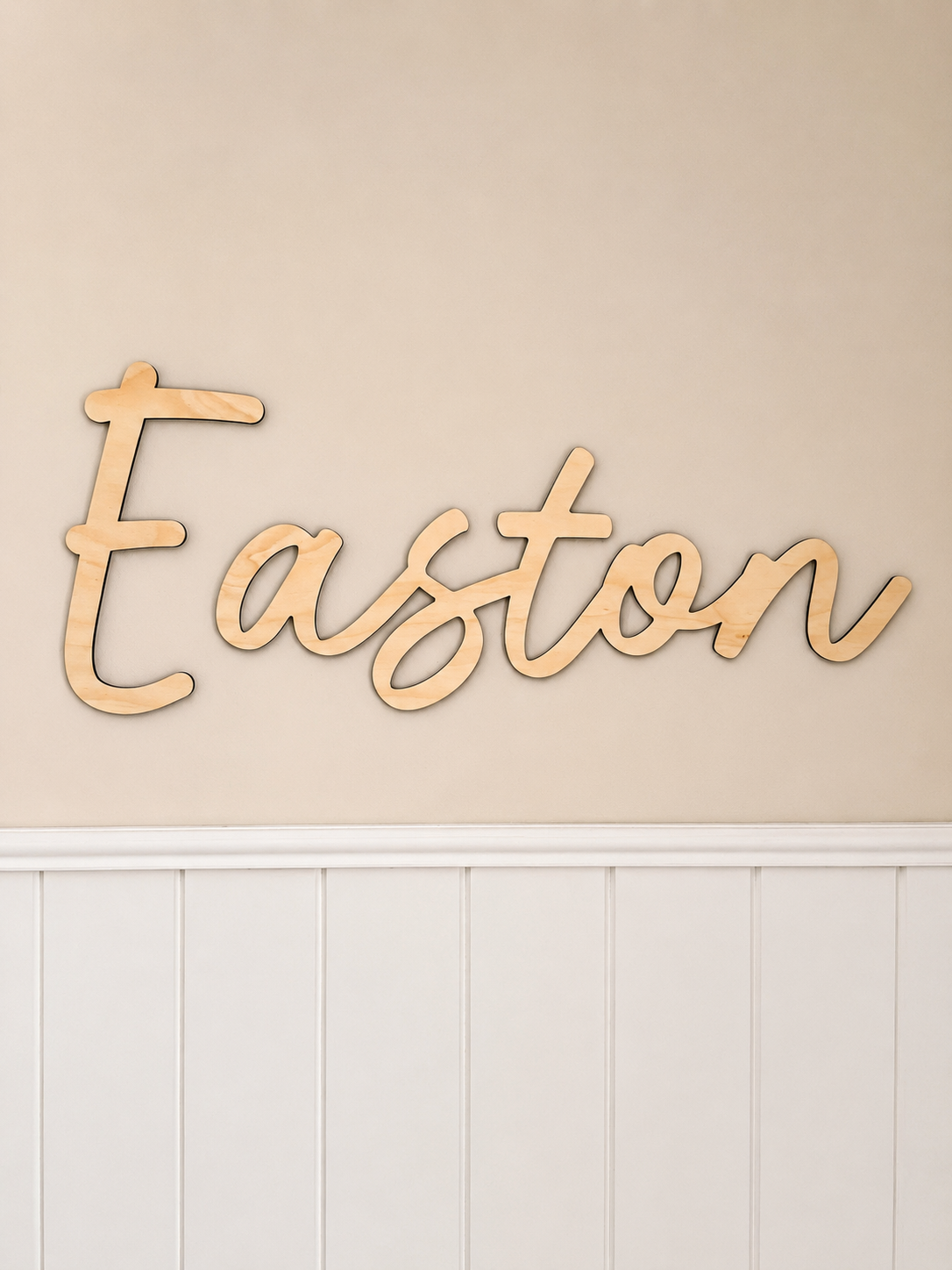 Personalised timber name sign made from 4mm Hoop Pine timber mounted on a nursery wall.